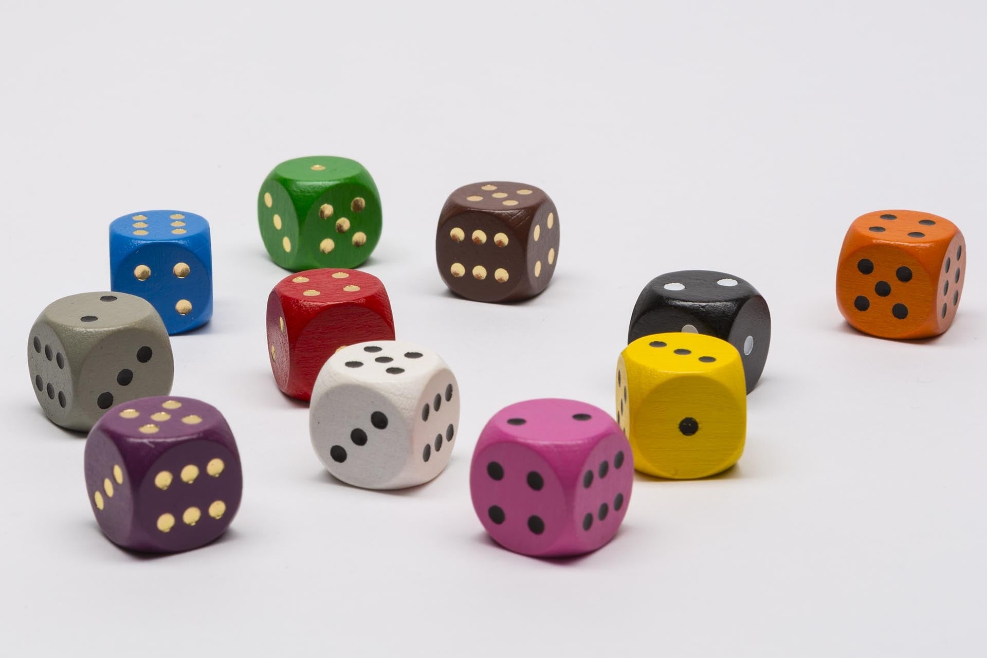 Wooden dice with golden dots