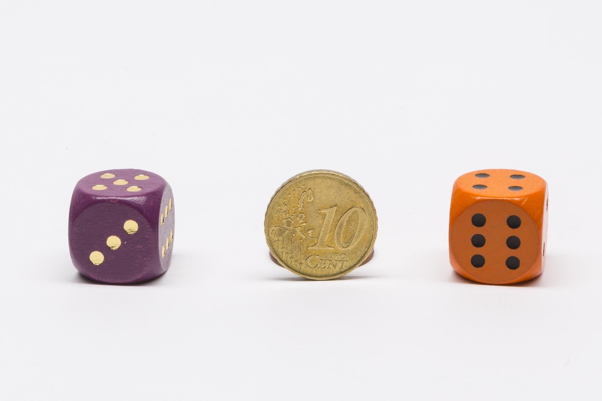 Wooden dice with golden dots