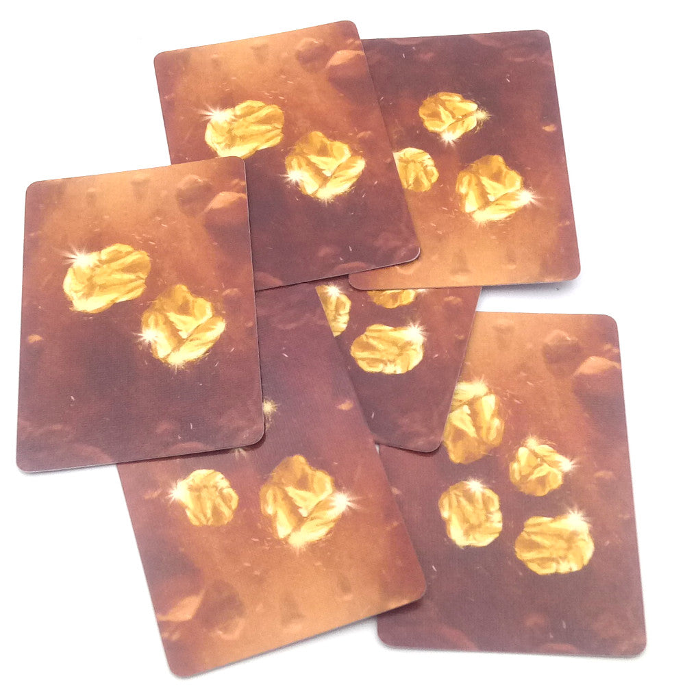 Set playing cards with gold nuggets