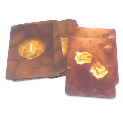 Set playing cards with gold nuggets