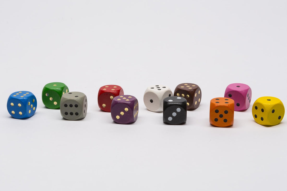 Wooden dice with golden dots